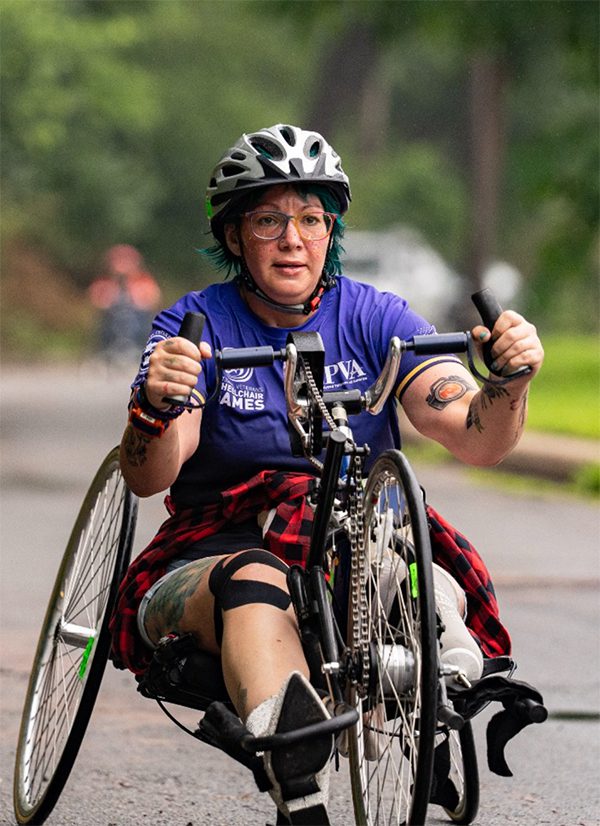 athletic woman in bicycle wheelchair